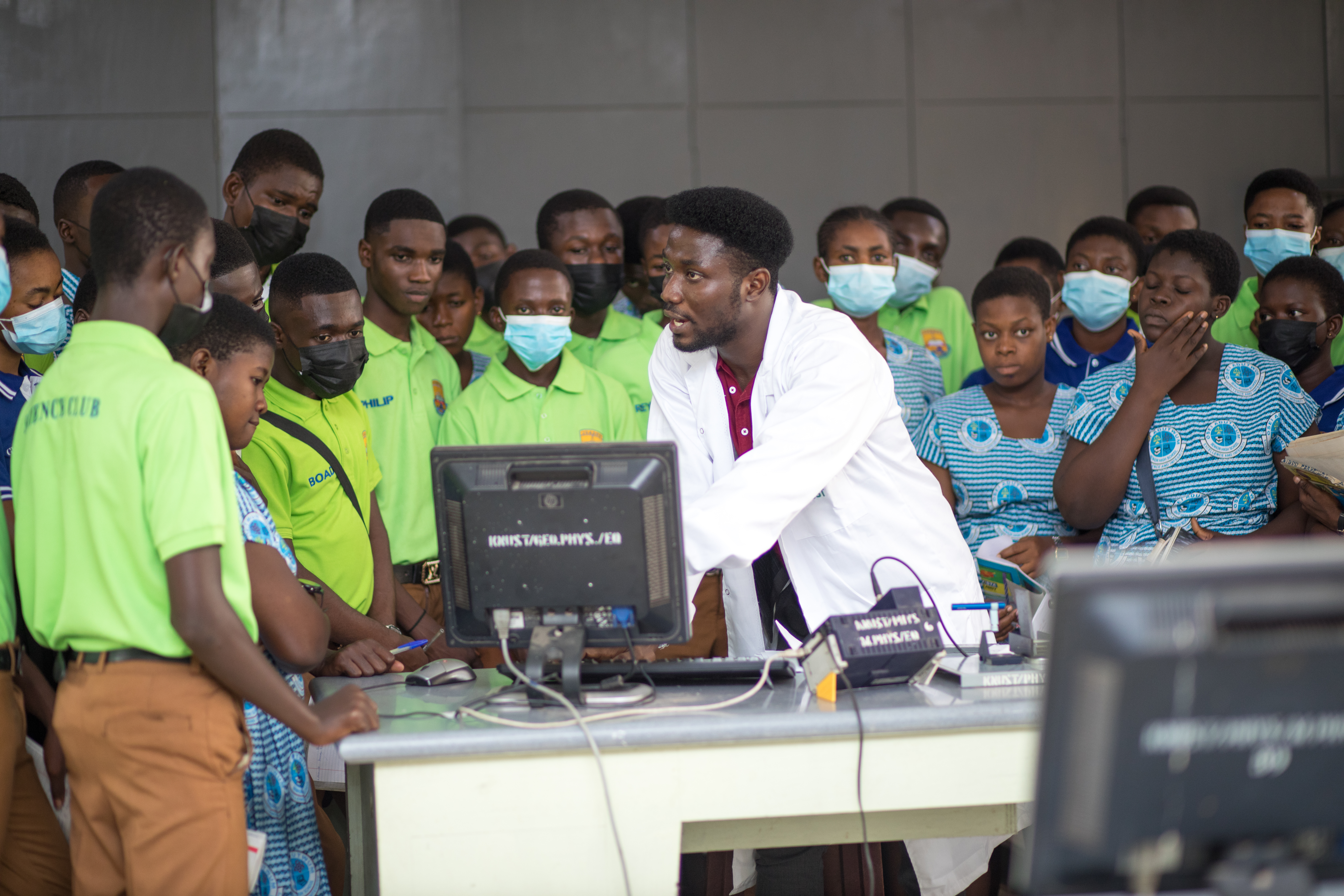 the student with an instructor in a lab